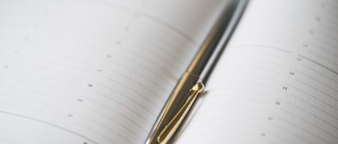 silver-pen-in-open-business-day-planner-diary-picjumbo-com non-digital